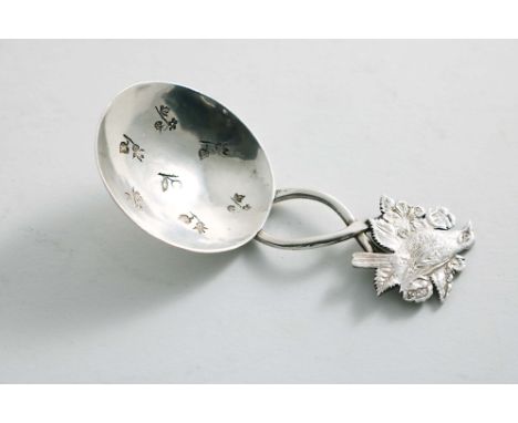 A LATE 20TH CENTURY CADDY SPOON with a wire stem, a circular bowl, stamped with seven incuse flowers and a shaped terminal, s