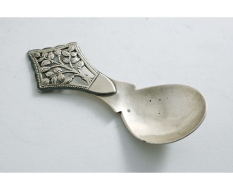 A POST WAR HANDMADE CADDY SPOON with a "tree of life", pierced terminal, by Peter C. Cook*, London 1946;  4"  (10 cms) long; 