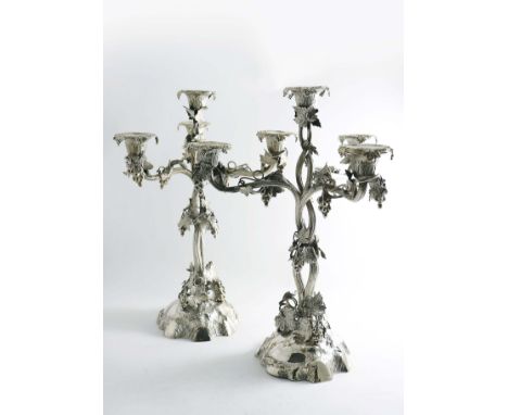 A PAIR OF VICTORIAN FOUR-LIGHT, NATURALISTIC CANDELABRA with vine stems &amp; branches, leaves &amp; grapes and shaped circul
