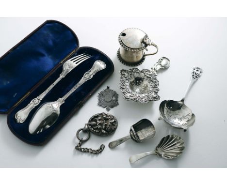 A MIXED LOT:- A tea strainer, a Continental tea strainer, a small mustard pot (glass liner), a fob, initialled "M", a cased s