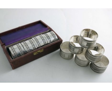A LATE VICTORIAN CASED SET OF FOUR NAPKIN RINGS with pierced borders, by R. Martin &amp; E. Hall, Sheffield 1896, together wi