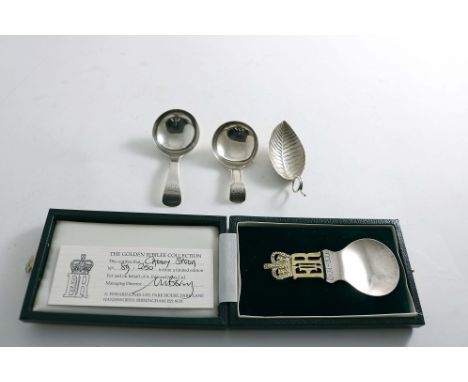 FOUR CADDY SPOONS:- A George III leaf spoon by Joseph Taylor, Birmingham 1799, two other antique caddy spoons, both initialle