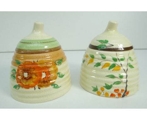 TWO CLARICE CLIFF BEEHIVE SHAPED HONEY POTS WITH LIDS