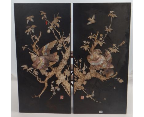 PAIR OF JAPANESE MEIJI PERIOD MOTHER OF PEARL AND IVORY COLLAGES on black lacquer panels, depicting hawks perched in trees, b