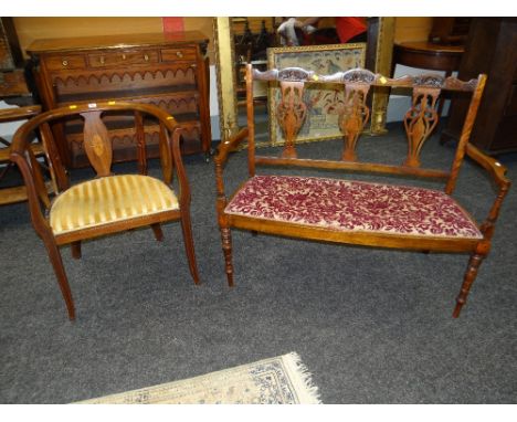 EDWARDIAN INLAID MAHOGANY TUB TYPE CHAIR with stripy upholstered seat; together with a two seat drawing room sofa with carved