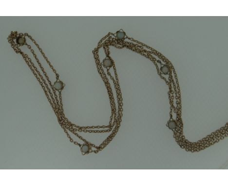 BELIEVED YELLOW GOLD &amp; OPAL SEQUENCE LONG NECKLACE having fifteen opposing demi-sphere opals (one missing), believed gold