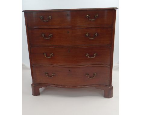 FINE GEORGE III QUALITY MAHOGANY SERPENTINE CHEST with fitted dressing drawer or secretaire having internal compartments and 