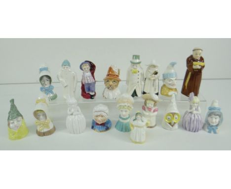 COLLECTION OF SEVENTEEN ROYAL WORCESTER PORCELAIN CHARACTER CANDLE SNUFFERS including Punch, Toby, Mrs Caudle, Howard, togeth