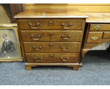 GOOD CHEST OF DRAWERS composed of four graduated long drawers on bracket feet, brass swan-neck handles, brass escutcheons, 78