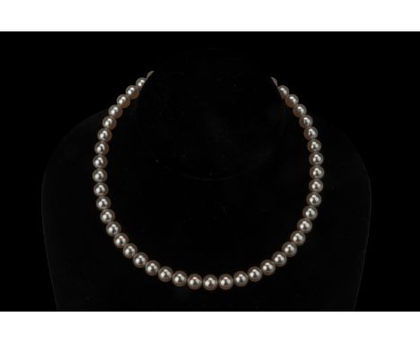 AN AKOYA CULTURED PEARL SINGLE STRAND NECKLACE The Akoya cultured pearls measuring 7.5 to 8mm, with gold clasp marked 'K14' 3