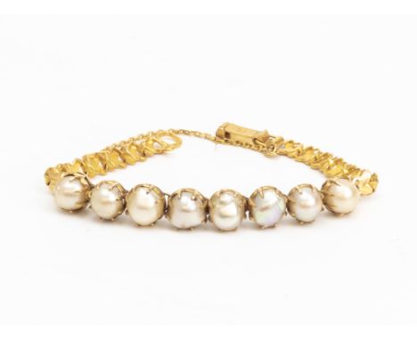 A PEARL AND GOLD BRACELET Featuring eight pearls mounted on a yellow gold bracelet with Chinese gold hallmark 14cm long 9.75g