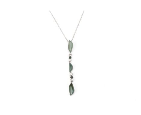 A JADE AND DIAMOND PENDANT ON CHAIN
Featuring free form jades totalling approximately 4.55 cts (marked), accented with round 