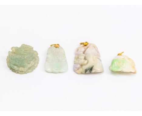 A GROUP OF FOUR CARVED JADE PENDANTS
Featuring four Jade pendants with various decoration, all mounted with an unmarked yello