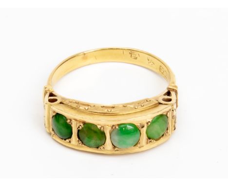 A JADE AND GOLD RING
Featuring four jade cabochons mounted in a yellow gold ring with various Chinese marks
US Size 7
5.17g
C