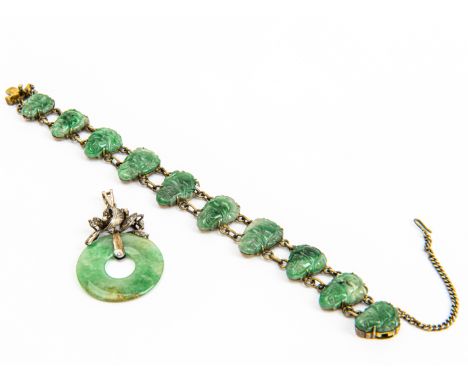 A JADE BRACELET AND PENDANT
Comprising: a 'Peace' pendant, and a bracelet with ten 'Mi-le' carved jades, both pieces mounted 