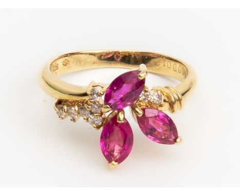 A RUBY AND DIAMOND RING
Featuring marquise cut rubies weighing approximately 1.00 cts total (marked) mounted in a yellow gold