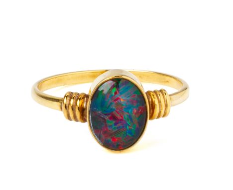 AN OPAL SINGLE STONE RING
Featuring an oval opal cabochon, possibly doublet or triplet, mounted in a bezel setting marked '75