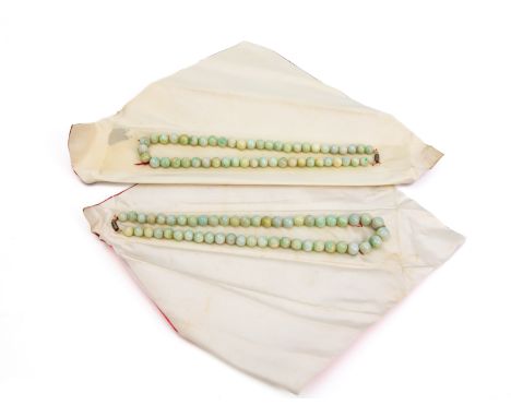 TWO JADE BEAD SINGLE STRAND NECKLACES
The beads measuring approximately 9.5-10.5mm.
Approximately 50cm long
Condition: For a 