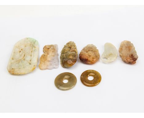 A GROUP OF CARVED AND 'PEACE' JADE ITEMS
Featuring six carved jade pieces, together with two 'peace' jade discs 
The largest 