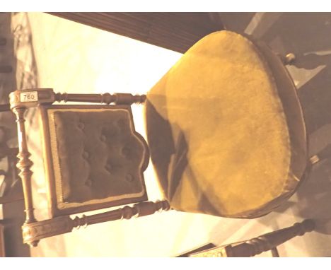 Victorian button back upholstered nursing chair with turned front legs and rail on ceramic castors 