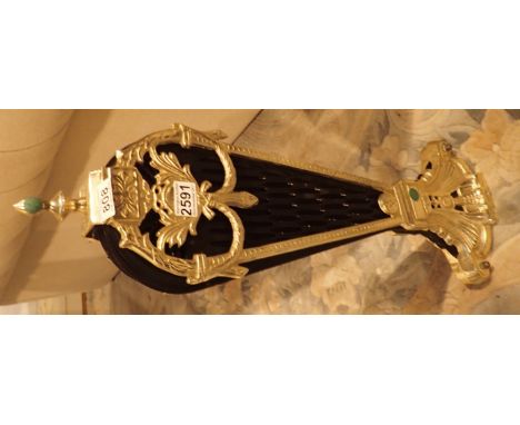 Black metal and brass peacock firescreen