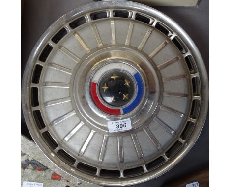 A set of 4 1969 Ford Zodiac chrome and enamel wheel trims 
