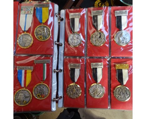 An album of Vintage Continental sporting medallions etc 