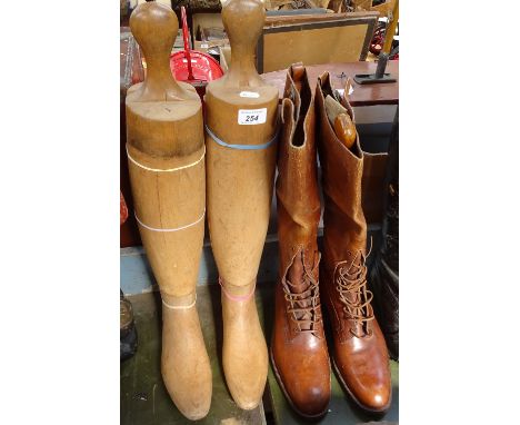 Vintage brown leather boots, and a pair of wooden boot trees 