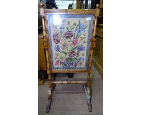 A Victorian walnut-framed firescreen, with an inset woolwork panel, W48cm 