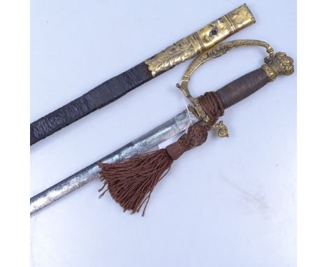 A 19th century Continental sword and scabbard with embossed brass mounts, blade length 32" 