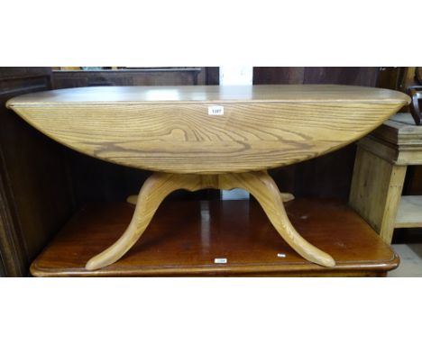 A modern Ercol oak drop leaf coffee table on sabre leg base, L122cm 