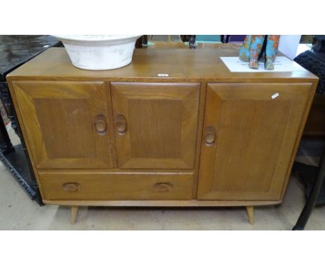 An Ercol elm Windsor sideboard with fitted cupboards and single drawer, W114cm 