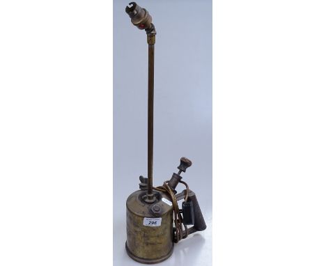 A brass blow torch converted to a table lamp 