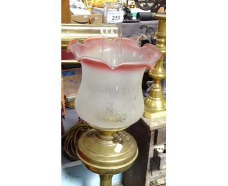 A brass oil lamp with chimney and shade, 23" 