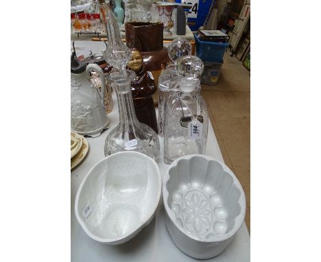 3 glass decanters, monk decanter, and 2 Vintage pottery jelly moulds 