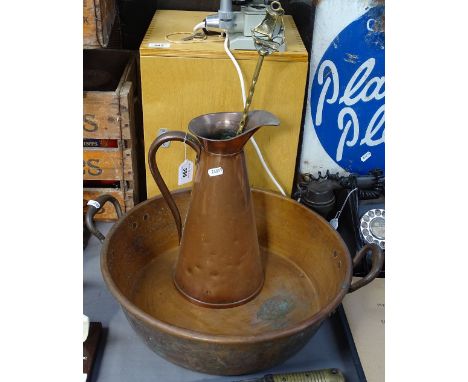 A copper jam pan, a jug, and toasting fork 