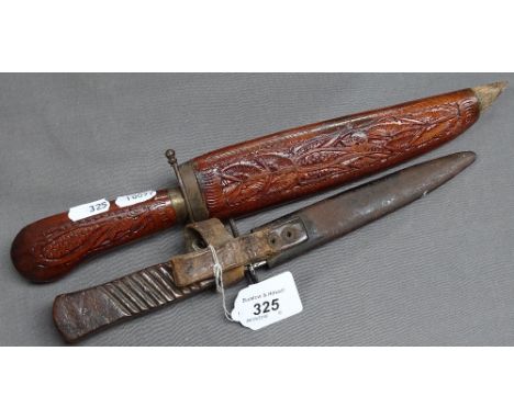 A First World War dagger inscribed 1.10.18 Somme, 10.5" in scabbard, and an Eastern knife 