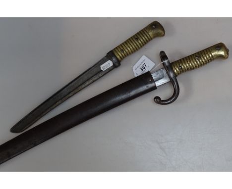 A brass-handled bayonet, 14", and a long brass-handled bayonet in scabbard 