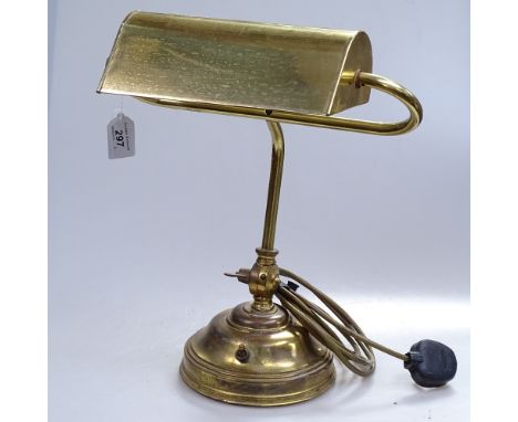 A brass adjustable desk lamp, and a bell 