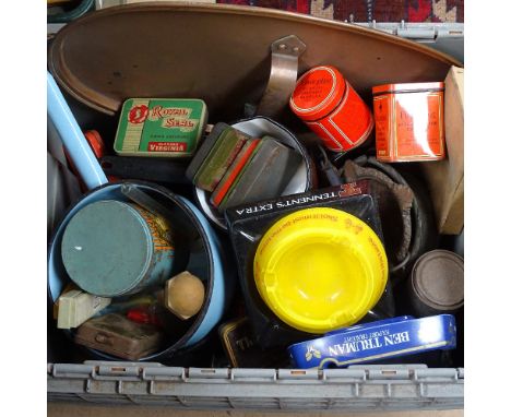 Bar ashtrays, an enamel pan, and tins 