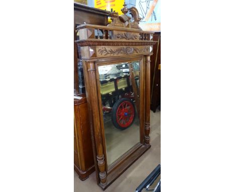 An Antique French walnut over mantel mirror, with carved decoration and fluted pilasters, W101cm, H185cm 