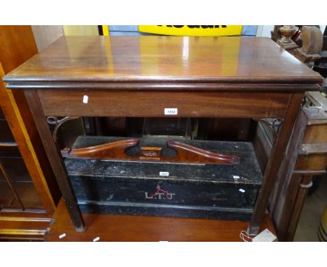 An Antique mahogany rectangular fold over card table, W86cm 