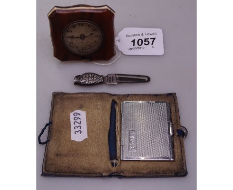 A silver owl bookmark, and a small travel clock and a case with enamel button 