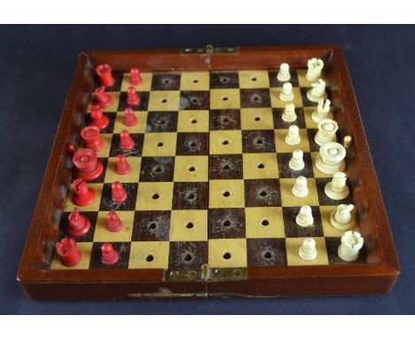 A Travellers Turned Ivory, Patent Chess Set, by  - Jaques London - Late 19th century - The playing board is constructed of ma