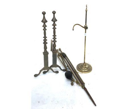 A pair of brass fire dogs, together with various brass fire tools, etc 