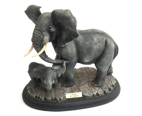 A modern elephant and calf 'Caring' by Jay Noble, together with a stylised ceramic figure of a dog, a model boat, Royal Brier