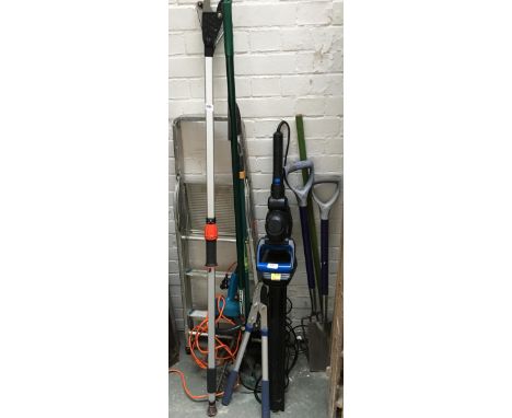 A quantity of garden tools to include Black &amp; Decker electric hedge trimmer, MacAllister hedge trimmer, several pruners, 