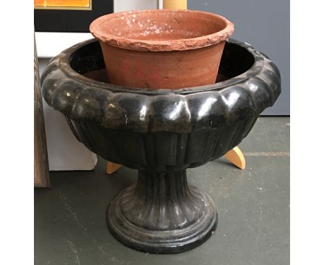 A glazed ceramic garden urn/planter, together with a terracotta flower pot