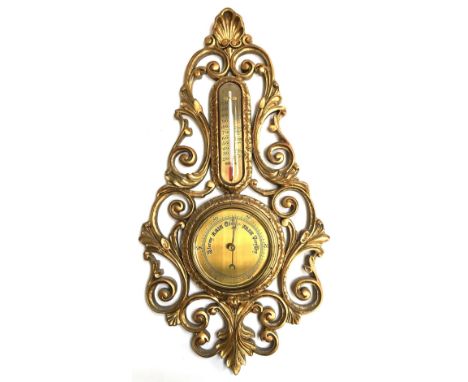 A giltwood barometer/thermometer, with carved pierced scrolling decoration and shell cresting, 54.5cmH 