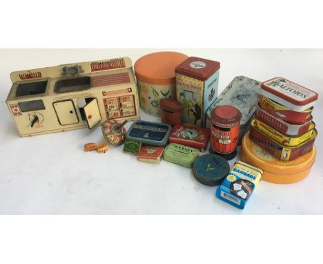 A mixed lot to include tins and tin plate toys, including an oven and sink, spinning top, various tins including a 1953 Oxo t